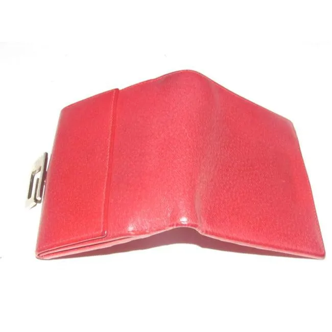 Gucci, true red leather, bi-fold, wallet with a change purse, gold G hinged closure, and lots of interior card slots