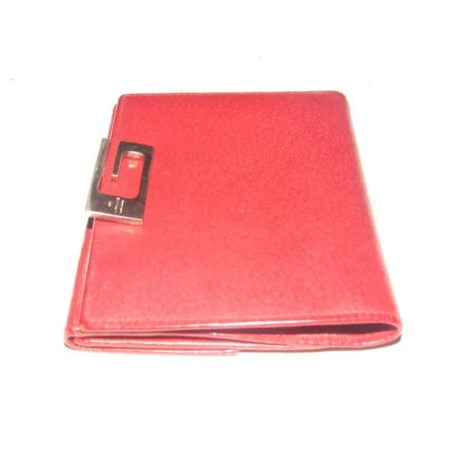 Gucci, true red leather, bi-fold, wallet with a change purse, gold G hinged closure, and lots of interior card slots